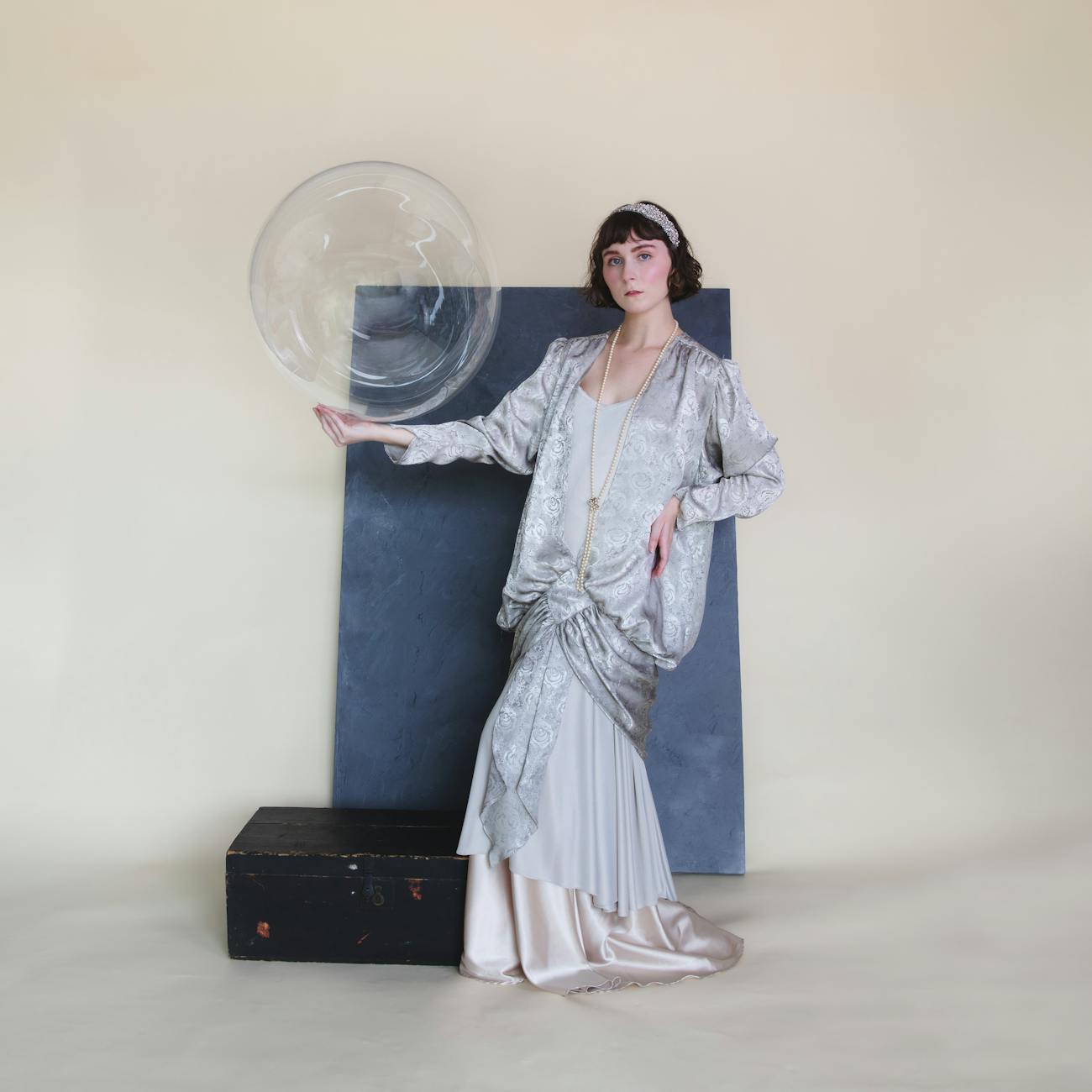 vintage fashion model with bubble prop in studio